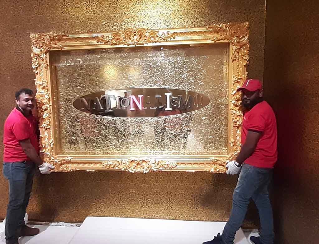 Two men carrying a large sign | Pearl Relocation